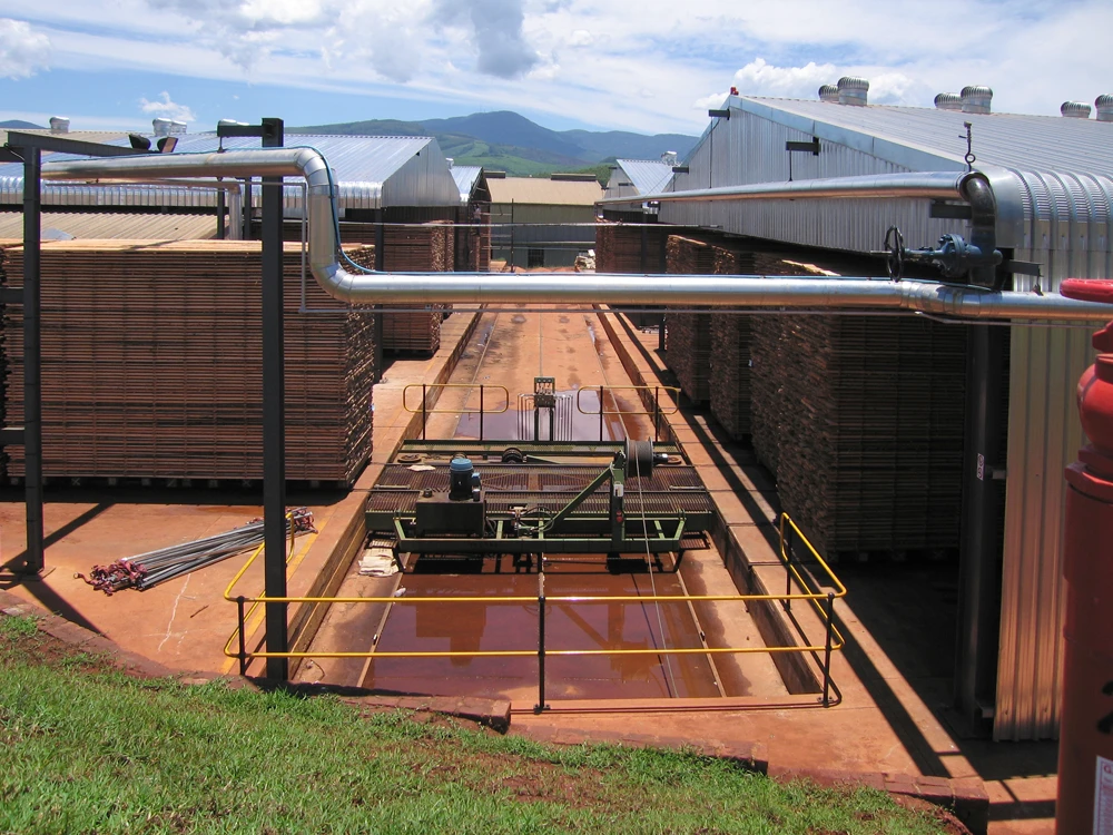 A central cross traverse provide a flow of timber into the loading area of all 4 kilns